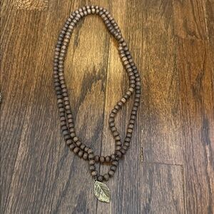 Brown Beaded Necklace with Leaf Pendant